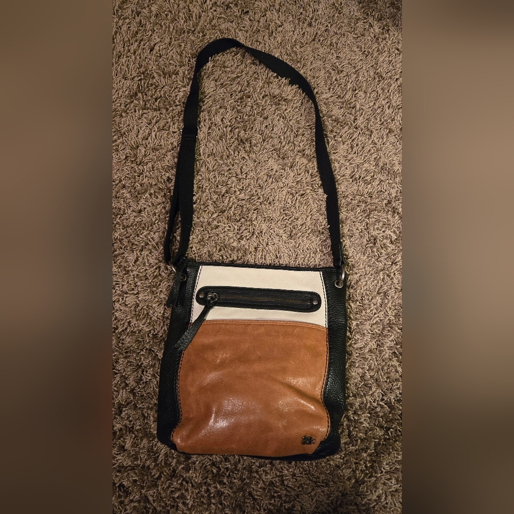The Sak leather crossbody. Has small blemish as seen in photo.